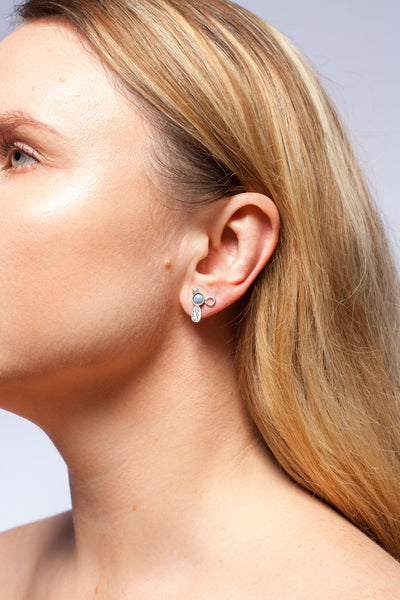 Mismatched silver stud earrings with sky blue ceramic details
