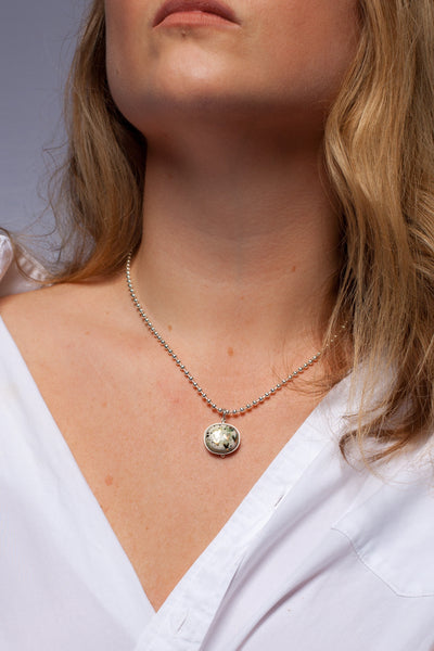 Green pendant with gold luster hearts