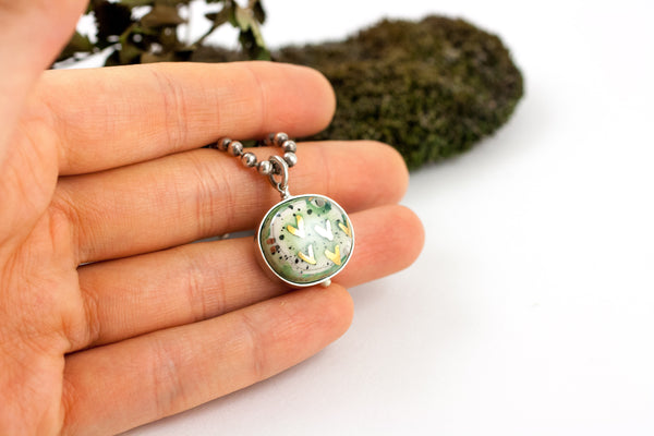 Green pendant with gold luster hearts
