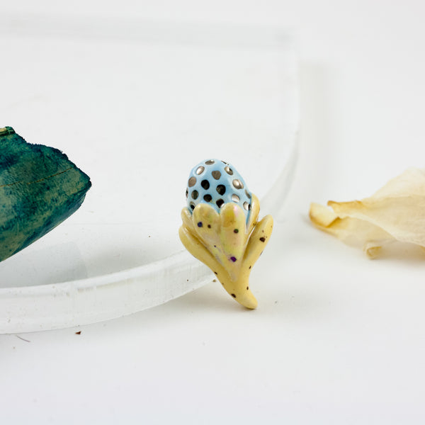 Yellow and blue organic form brooch with platinum luster