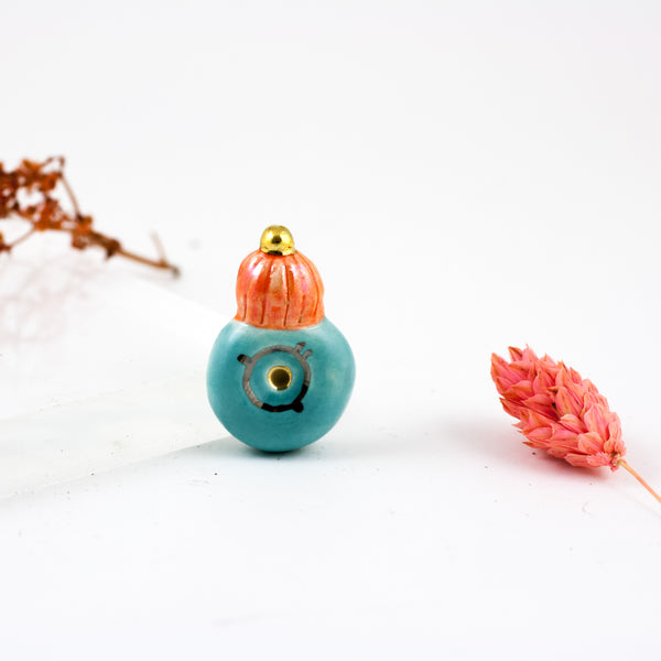 Orange and turquoise color brooch with platinum and gold luster