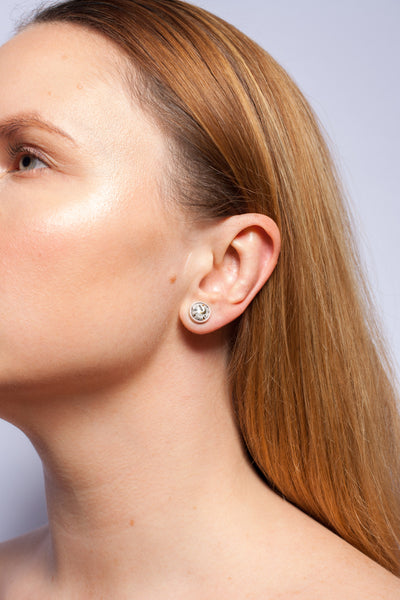 White mismatched silver earrings with gold decoration