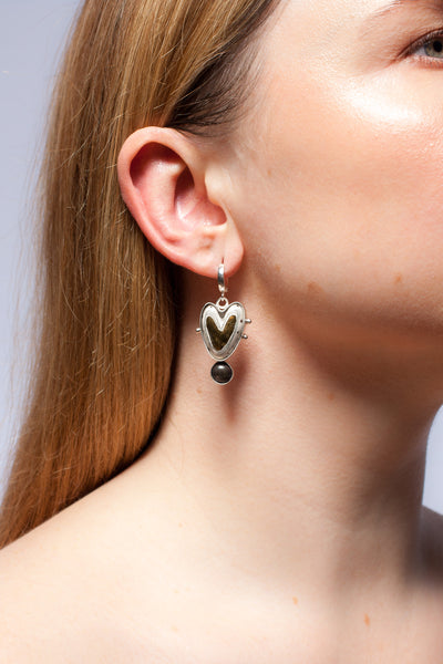 Long mismatched heart shaped silver earrings
