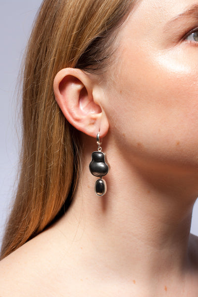 Dangle black mismatched earrings with platinum luster