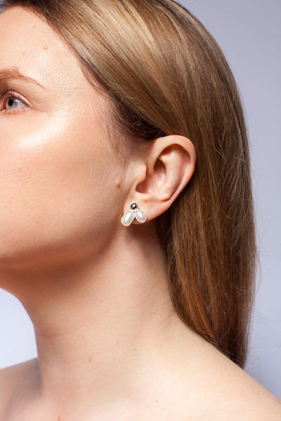 Silver stud earrings with freshwater pearls and platinum plated ceramics