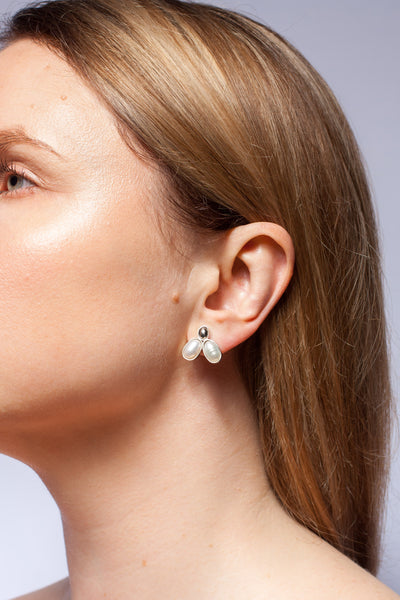 Silver stud earrings with freshwater pearls and platinum plated ceramics