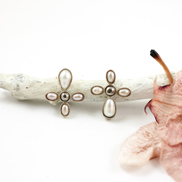 Mismatched silver stud earrings with freshwater pearls and ceramics details