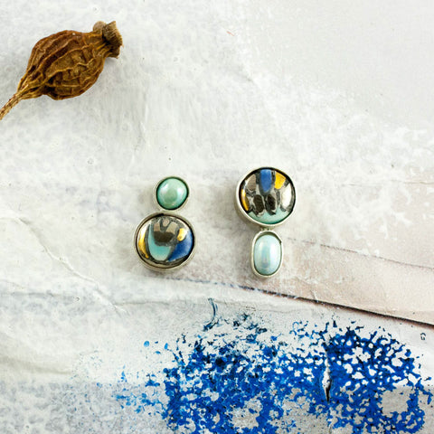 Blue mismatched silver stud earrings with gold lines