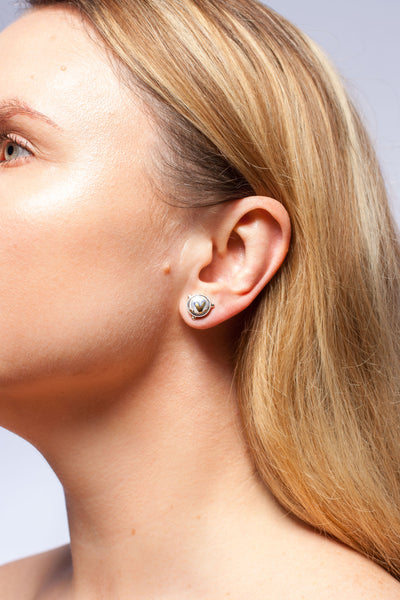 Blue round earrings with platinum and gold luster