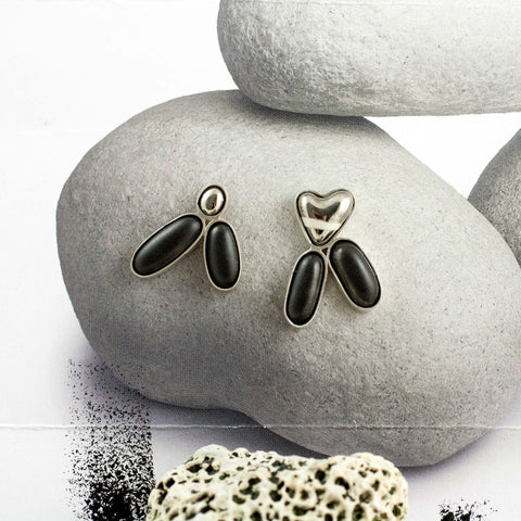 Dark mismatched earrings with platinum luster