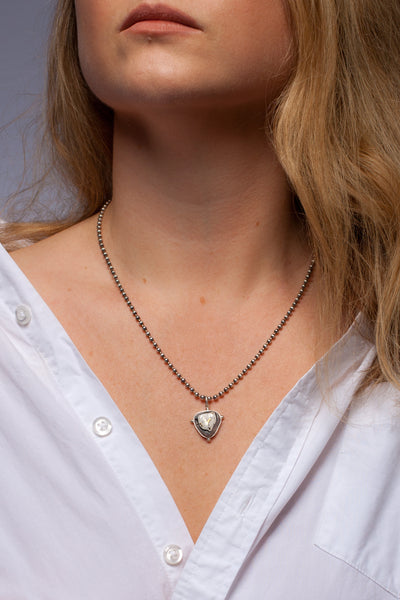 ABSTRACT grey pendant with a gold heart