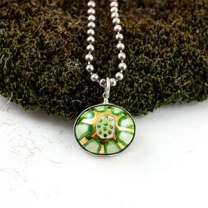 Green and gold color round pendant