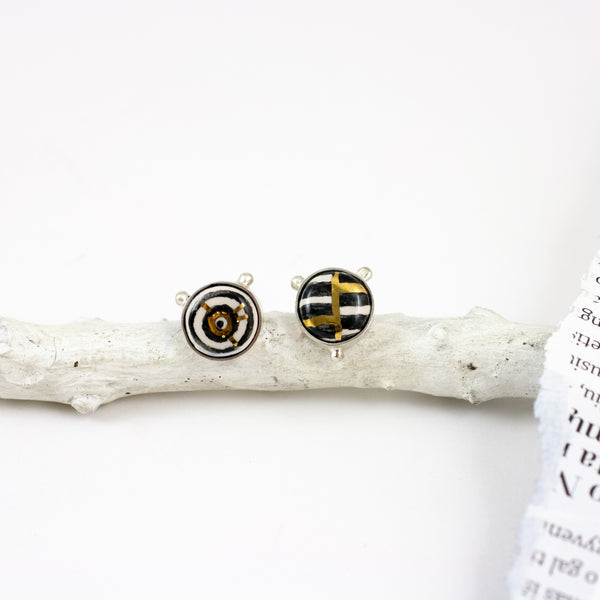 ABSTRACT Mismatched earrings witch gold luster