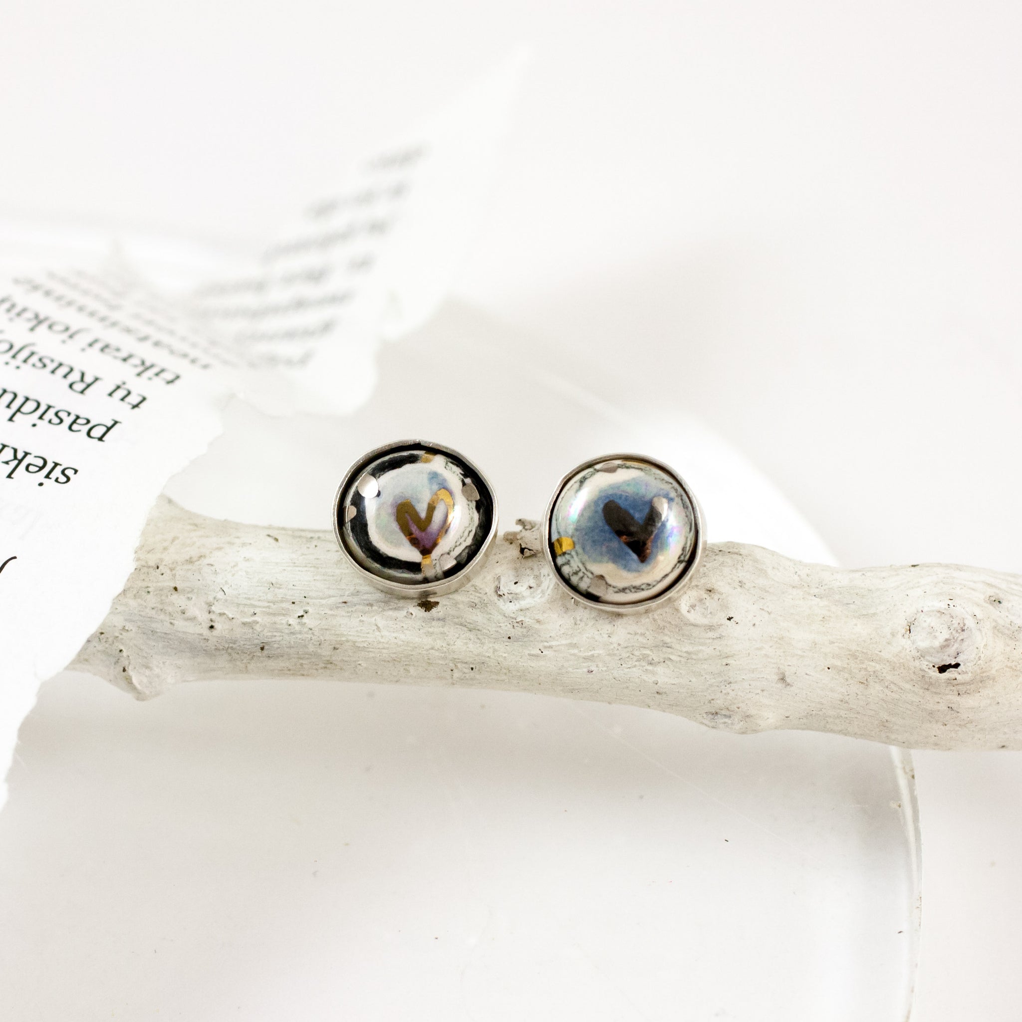 Blue mismatched silver earrings with tiny hearts