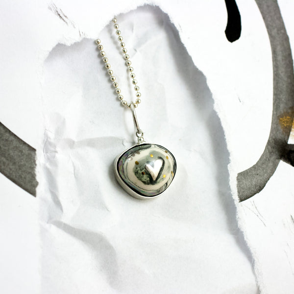 ABSTRACT black and white ceramic pendant with a platinum heart