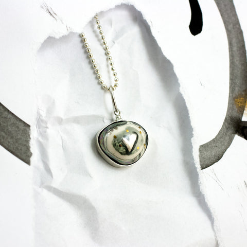 ABSTRACT black and white ceramic pendant with a platinum heart