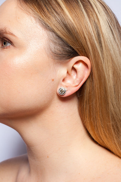 ABSTRACT Mismatched earrings witch gold luster