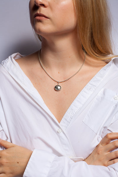 BON BON black oval form pendant with a platinum crown