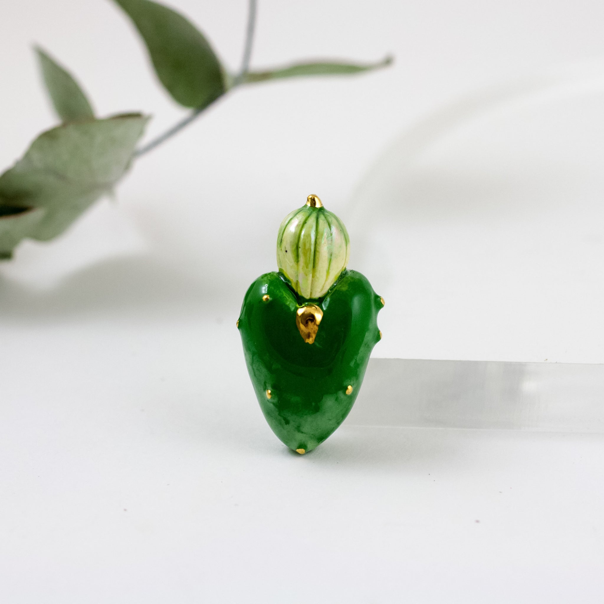 Dark green heart-shaped brooch with gold luster decor