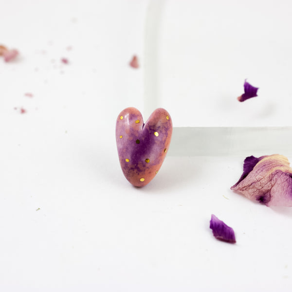 Pink and purple heart-shaped brooch with small gold dots