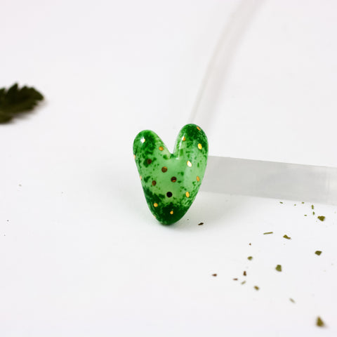 Green heart-shaped ceramic brooch with dots