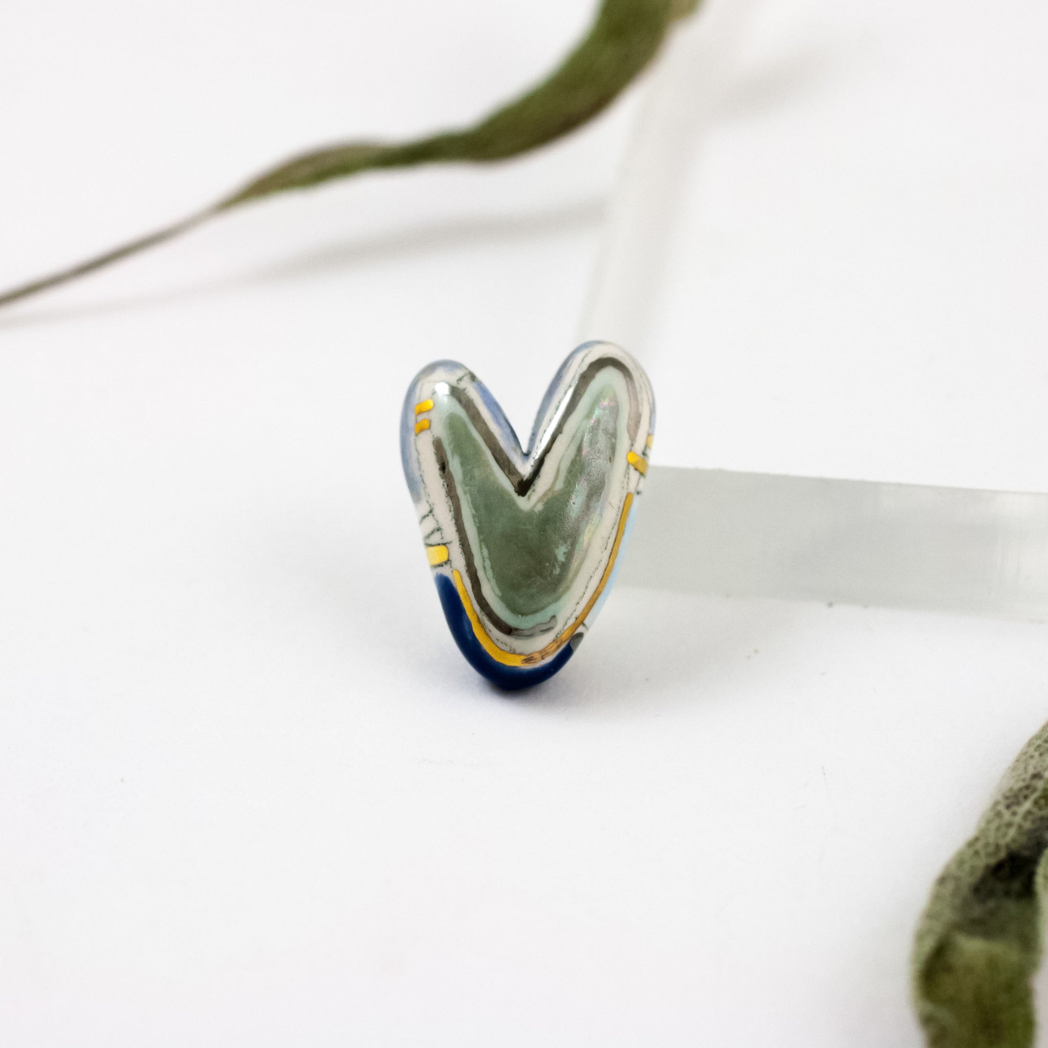 Multi colored blue toned heart-shaped brooch