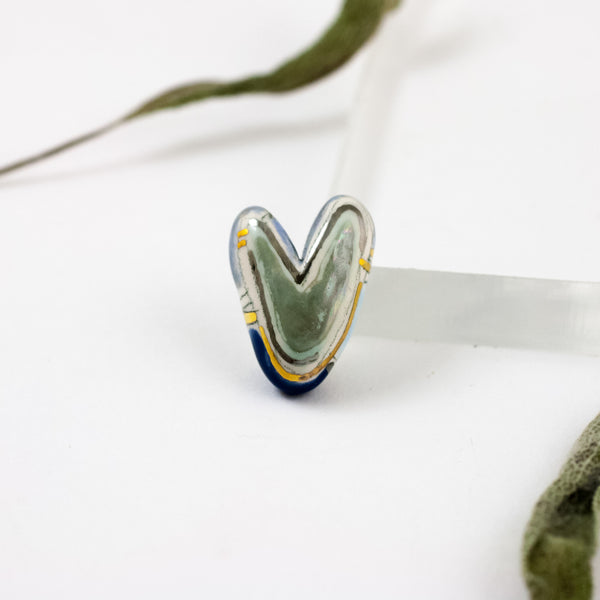 Multi colored blue toned heart-shaped brooch