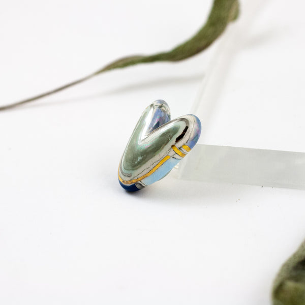 Multi colored blue toned heart-shaped brooch