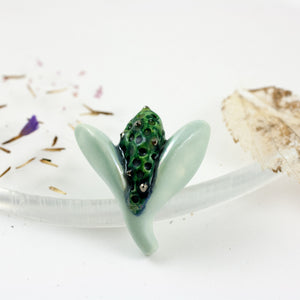 Blue and green color organic flower bud brooch