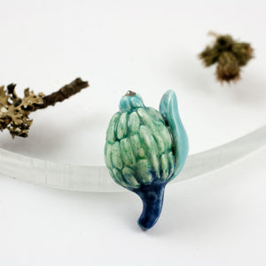 Blue organic form brooch with platinum luster