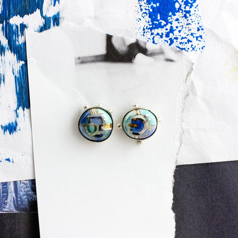 Blue mismatched silver earrings with gold luster lines