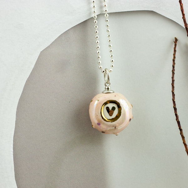 Pink small ceramic pendant with a golden heart