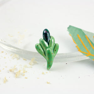 Bright and dark green color organic brooch with pearl luster