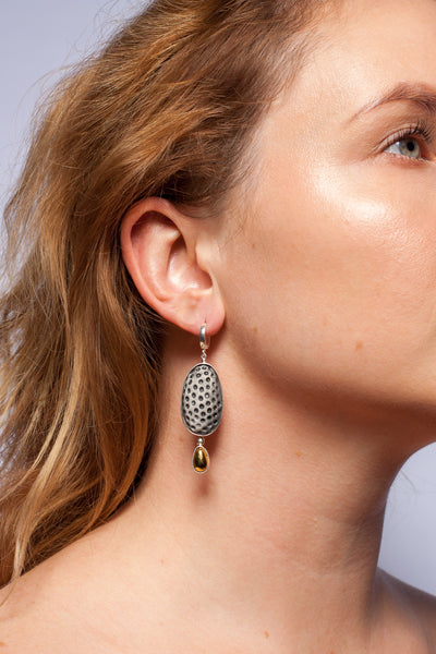 Gold plated dangle earrings with black color dots