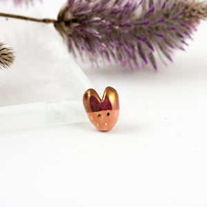 Red and pink heart-shaped brooch with pearl luster