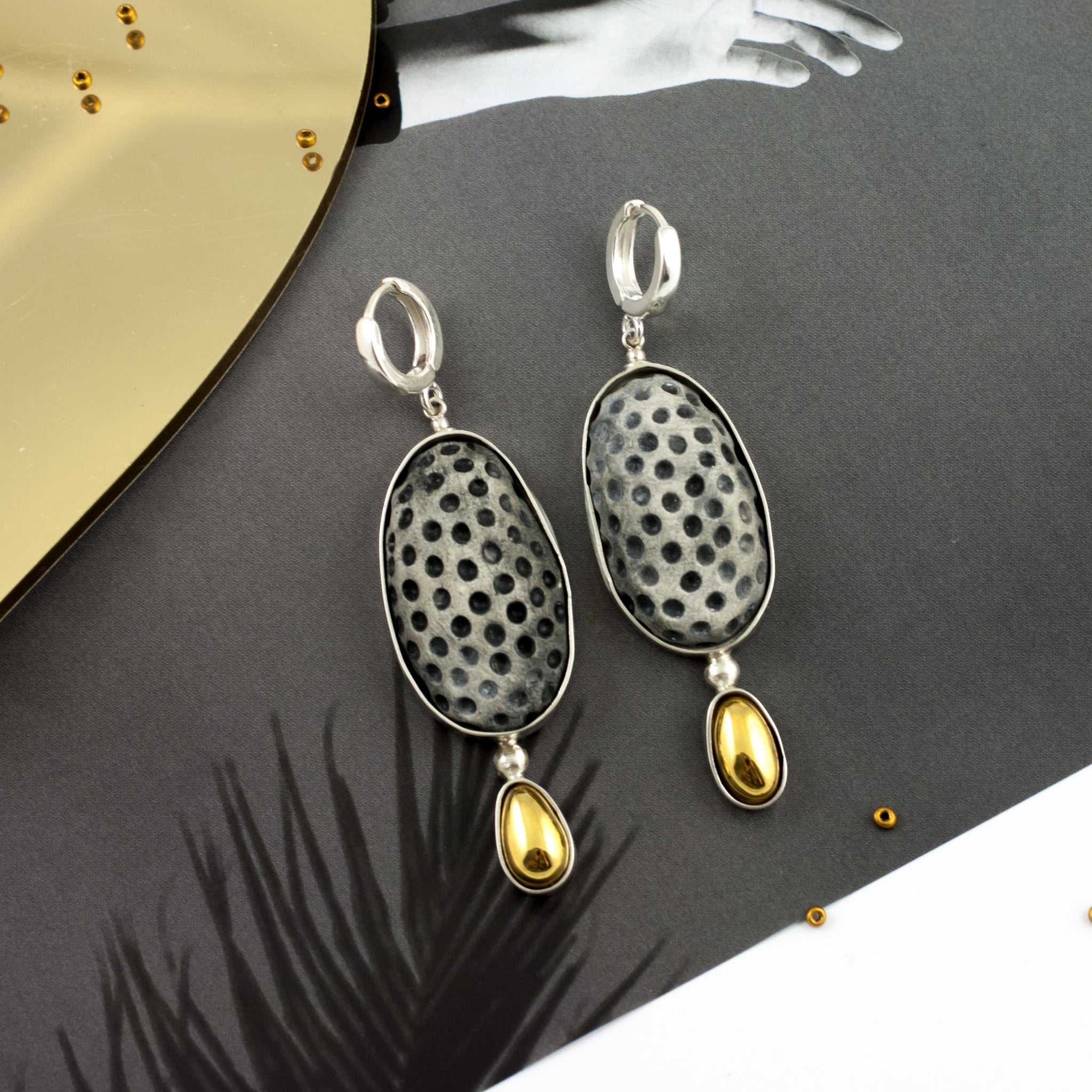 Gold plated dangle earrings with black color dots