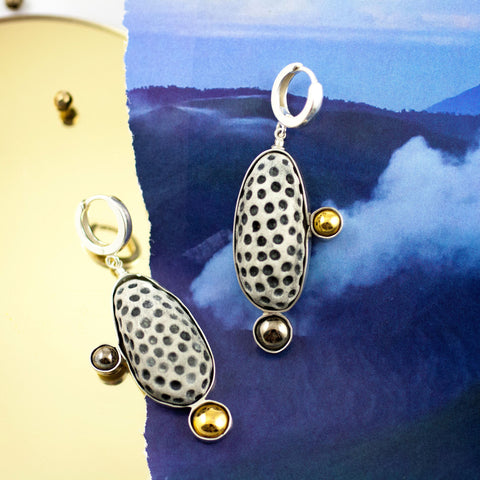 Gold and platinum plated earrings with black dots