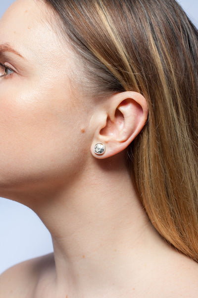 ABSTRACT Tiny earrings with fine metal luster decorated ceramics