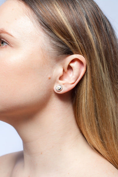 ABSTRACT Tiny earrings with fine metal luster decorated ceramics