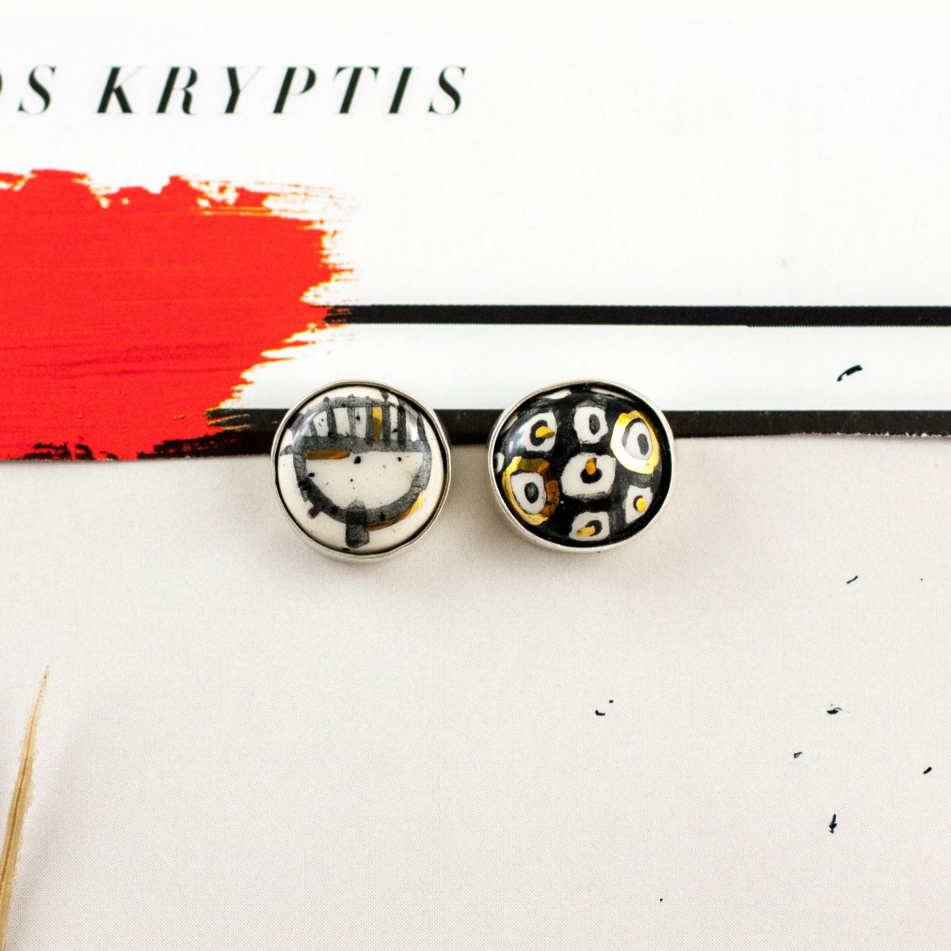 ABSTRACT white and black earrings with spots