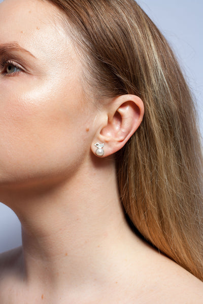 Silver stud earrings with white round freshwater pearls