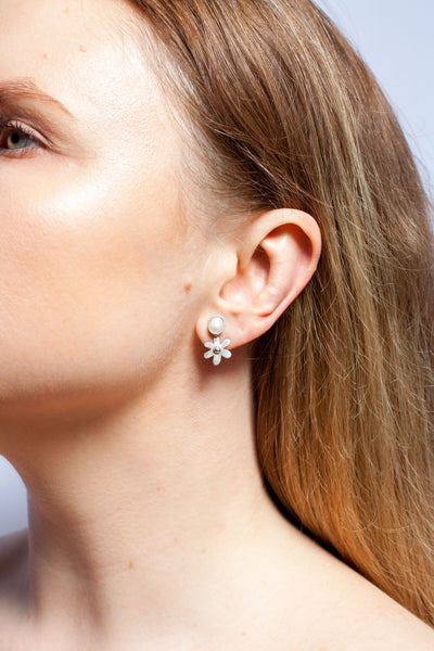 Asymmetrical floral silver stud earrings with freshwater pearls