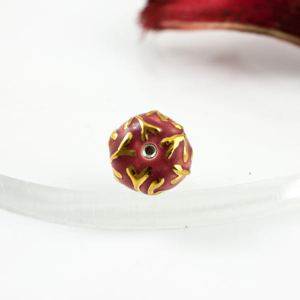 Burgundy color brooch with gold luster