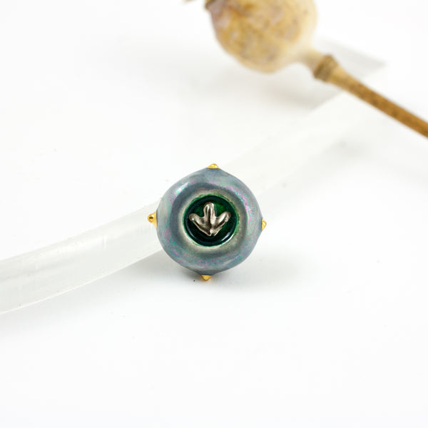 Blue brooch with a platinum luster flower