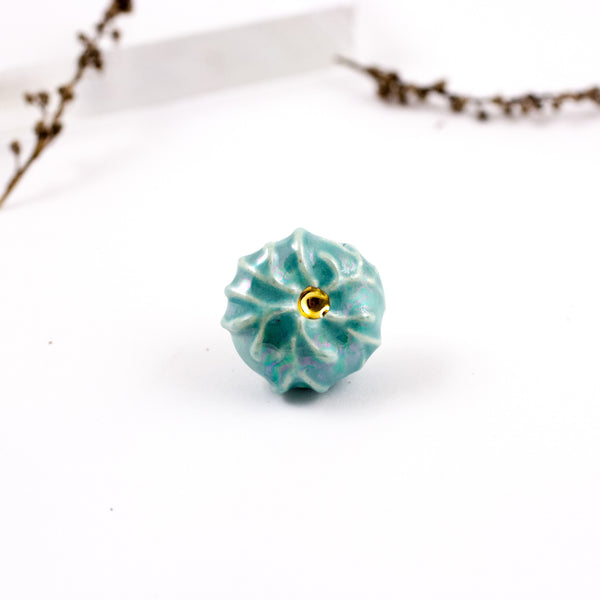 Organic shape blue color brooch with pearl luster