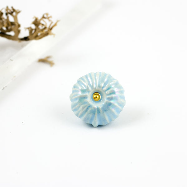 Baby blue ceramic organic form brooch with luster decor