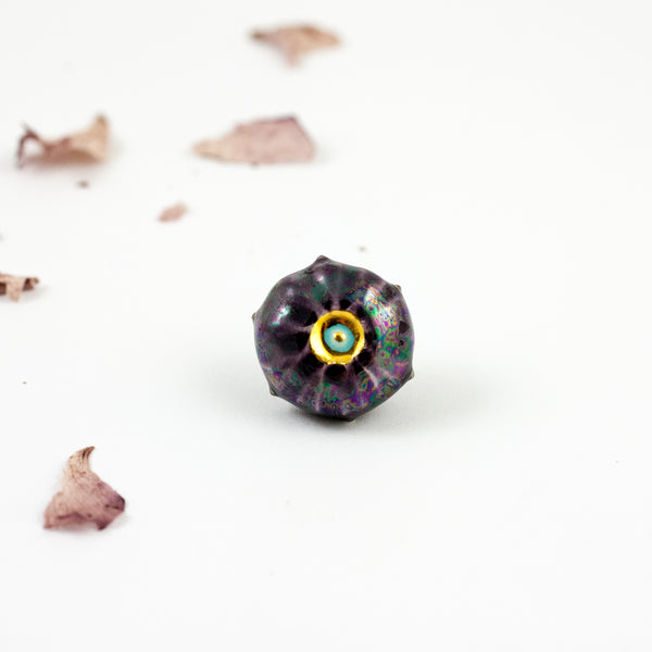 Aubergine color ceramic brooch with luster decor
