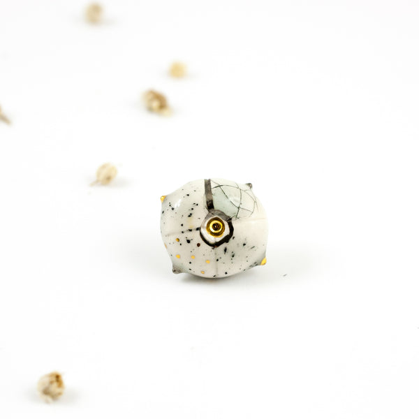 Speckled white organic form brooch with a cracle effect