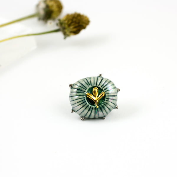 Organic form green brooch with shiny lusters