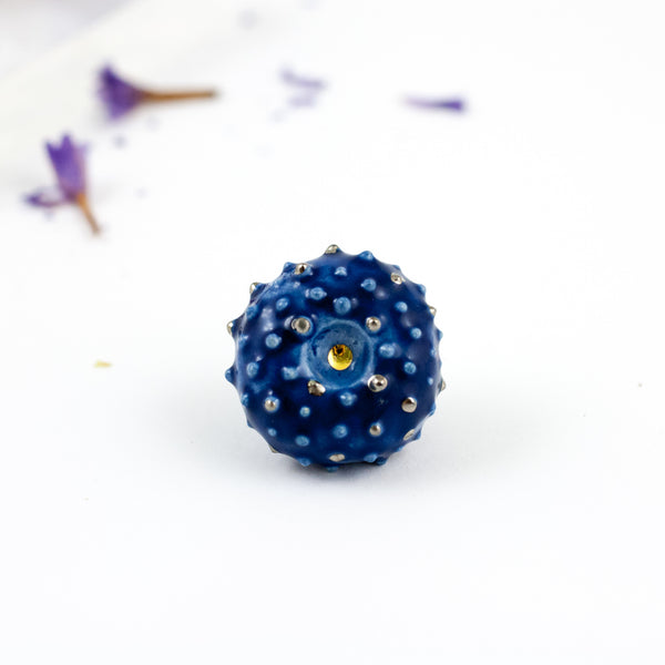 Dark blue ceramic brooch with platinum luster bumps